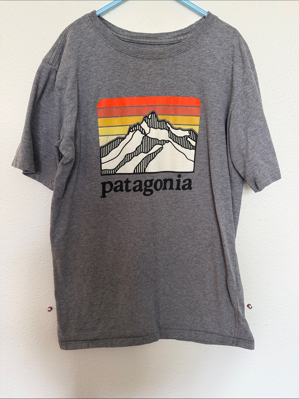 Patagonia Gray Tee with Red, Orange & Yellow Striped Mountain Graphic